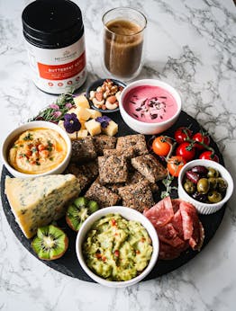 Keto-friendly Spring Grazing board with homemade seeded crackers